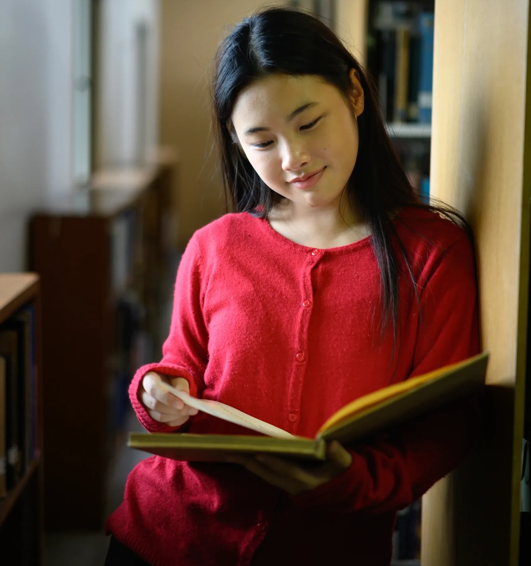 Teens laughing and enjoying books together